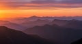 Vibrant Sunset Over Layered Mountain Ranges Panorama Royalty Free Stock Photo
