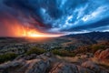 Dramatic Sunset over Mountain Valley Town with Rain Royalty Free Stock Photo