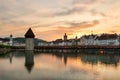 Dramatic sunset over the old town of Lucerne, Chapel Bridge and