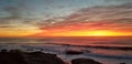 Dramatic Sunset over Pacific Ocean - Waves Crashing on the Rocks Royalty Free Stock Photo