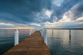 Dramatic sunset over a pier in the Chesapeake Bay, in Kent Island, Maryland Royalty Free Stock Photo