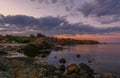 Red sky over a rocky seashore. Sunset landscape. Royalty Free Stock Photo