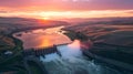 Dramatic sunset over rolling hills with a hydroelectric dam in the foreground. Beautiful landscape. Captivating scenery Royalty Free Stock Photo