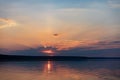 Dramatic sunset over sea water with cloudy sky Royalty Free Stock Photo