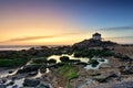 Dramatic sunset over the Sr da Pedra Chapel in Miramar Beach in Portugal