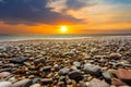 Dramatic sunset over the stony sea coast Royalty Free Stock Photo