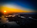 Dramatic sunset over tall skyline buildings in Sydney Harbour illuminated by the sunset Royalty Free Stock Photo