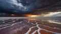 Dramatic Salt Flat Landscape with Stormy Clouds and Mirrored Reflections Royalty Free Stock Photo