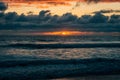 Dramatic sunset over waves in the Pacific Ocean in Imperial Beach, near San Diego, California