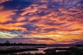 Dramatic sunset over a winding river Royalty Free Stock Photo