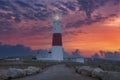 A dramatic sunset at the Portland Bill lighthouse on the south coast of England Royalty Free Stock Photo