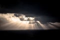 Dramatic sunset rays through a cloudy dark sky over the ocean Royalty Free Stock Photo