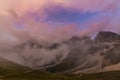 Dramatic scenery in the Dolomite Alps, Italy, in summer, with storm clouds and majestic peaks Royalty Free Stock Photo