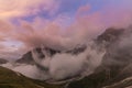 Dramatic scenery in the Dolomite Alps, Italy, in summer, with storm clouds and majestic peaks