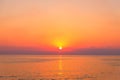 Dramatic sunset on sea wit sun reflection on water Royalty Free Stock Photo