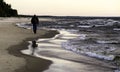 Dramatic sunset, seashore, strong winds and blurred waves,