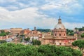 Dramatic sunset sky above the Church of Santi Luca e Martina and Great Roman Colosseum Royalty Free Stock Photo