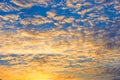 Dramatic sunset sky background with fiery clouds, yellow, orange and pink colors Royalty Free Stock Photo
