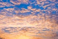 Dramatic sunset sky background with fiery clouds, yellow, orange and pink colors Royalty Free Stock Photo