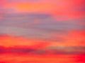 Dramatic sunset sky background with fiery clouds, yellow, orange and pink colors Royalty Free Stock Photo