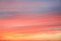 Dramatic sunset sky background with fiery clouds, yellow, orange and pink colour, nature background Royalty Free Stock Photo