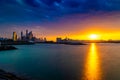 Dramatic sunset sky with clouds. Beautiful sunset over the Arabian sea in Dubai Marina UAE. Nature and beauty concept. Orange sund Royalty Free Stock Photo