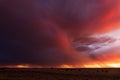 Colorful sunset sky with virga and storm clouds Royalty Free Stock Photo