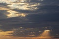 Dramatic sunset in the Sky through cumulus storm clouds, Royalty Free Stock Photo