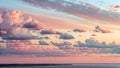 Dramatic sunset sky with pink and orange clouds over water Royalty Free Stock Photo