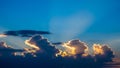 Dramatic Sunset Sky with Golden Edged Clouds and Blue Rays of Light Keywords: sunset, sky, clouds, blue sky, golden Royalty Free Stock Photo