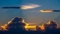 Dramatic Sunset Sky With Golden Light Illuminating Cumulus Clouds And Rays Of Sunlight Breaking Through The Atmosphere Royalty Free Stock Photo