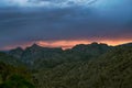 Dramatic sunset sky with monsoon rain over Thimble Peak in Tucson Royalty Free Stock Photo