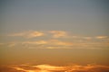 Dramatic sunset sky with orange colored clouds Royalty Free Stock Photo
