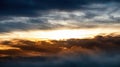 Golden Light Breaking Through Dramatic Clouds at Sunset Royalty Free Stock Photo