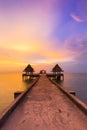 Dramatic after sunset sky over walking way leading to ocean skyline Royalty Free Stock Photo