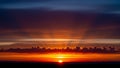 Dramatic Sunset Sky With Sun Rays Bursting Through Clouds Over Dark Horizon Line 20251228 Royalty Free Stock Photo