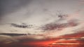 Dramatic sunset sky with vibrant orange and red clouds. Royalty Free Stock Photo