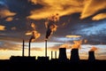 Dramatic sunset and smoking power plant Royalty Free Stock Photo