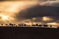 Dramatic Sunset and Stormy Overcast Sky over Rolling Hills Landscape in South of France Royalty Free Stock Photo