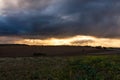 Dramatic Sunset and Stormy Overcast Sky over Rolling Hills Landscape in South of France Royalty Free Stock Photo