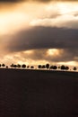 Dramatic Sunset and Stormy Overcast Sky over Rolling Hills Landscape in South of France Royalty Free Stock Photo