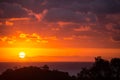 Dramatic sunset sun in clouds on the Pacific Royalty Free Stock Photo