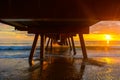 Dramatic sunset view from under pier