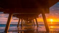 Dramatic sunset view from under pier