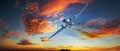 Dramatic sunset with vintage Douglas DC-3 airplane flying under a vibrant cloudy afternoon sky Royalty Free Stock Photo