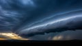 Dramatic supercell thunderstorm cloud formation with sunbeams breaking through dark ominous sky Royalty Free Stock Photo