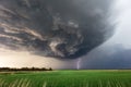 Dramatic supercell thunderstorm with lightning strike Royalty Free Stock Photo