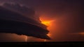 Dramatic supercell thunderstorm with lightning strikes at sunset dark clouds Royalty Free Stock Photo