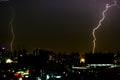 Dramatic thunder storm lightning bolt on the horizontal sky and city scape Royalty Free Stock Photo