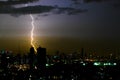 Dramatic thunder storm lightning bolt on the horizontal sky and city scape